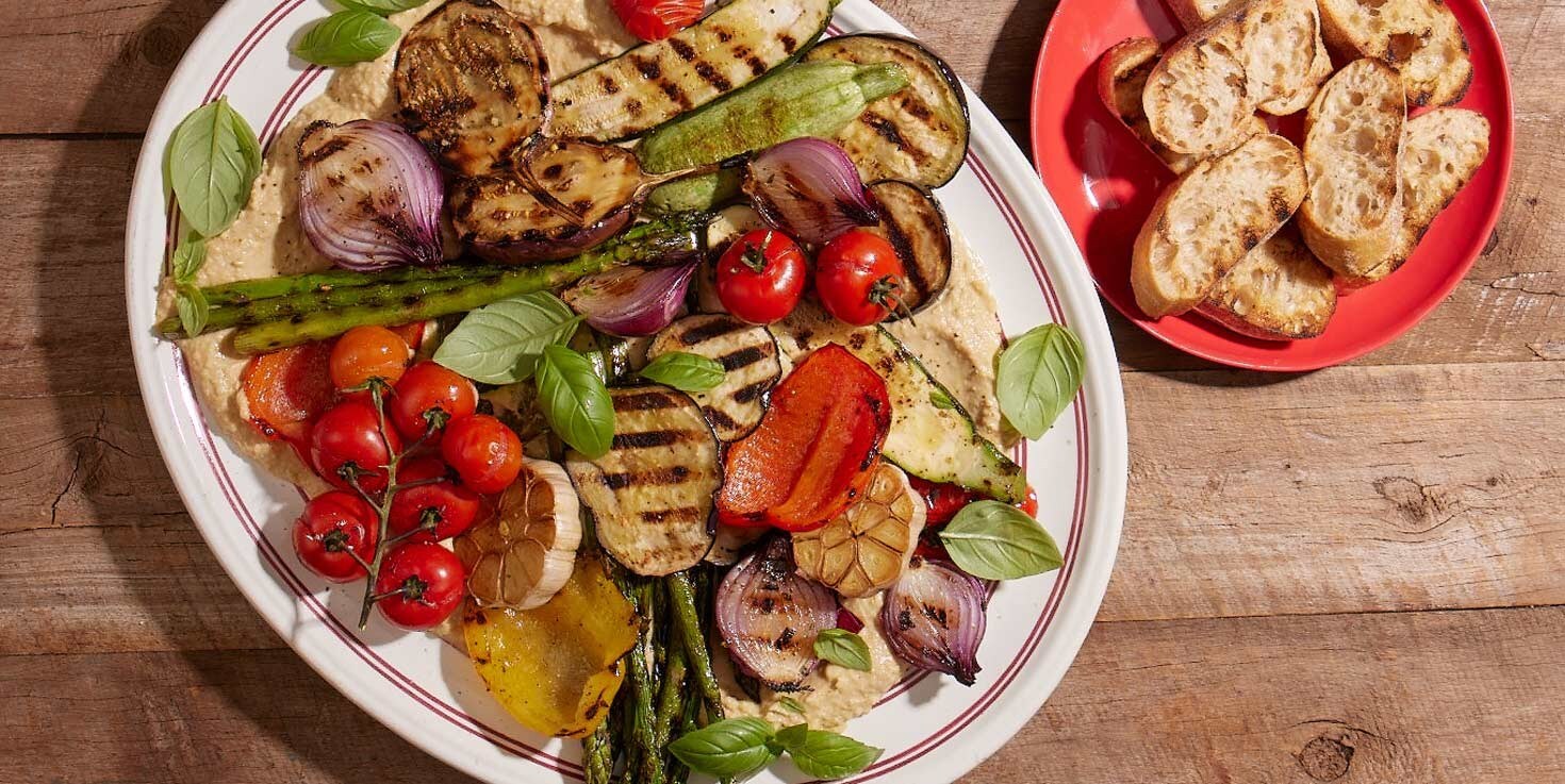 Grilled summer vegetable salad with hummus
